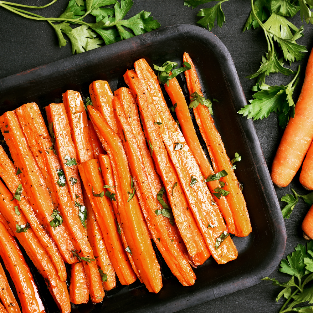 Onion, garlic, and ginger sautéing in a pot as the base for carrot ginger soup.