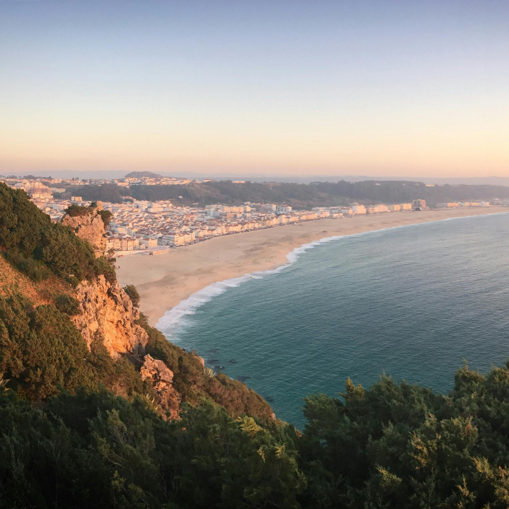 Giant Atlantic waves crashing in Nazaré, a famous surfing destination in Portugal.