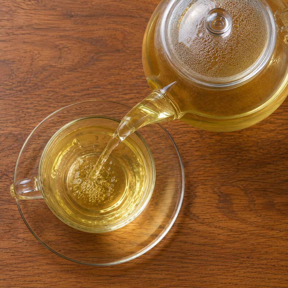 Homemade Lemon balm tea with fresh lemon balm leaves, honey, and lemon