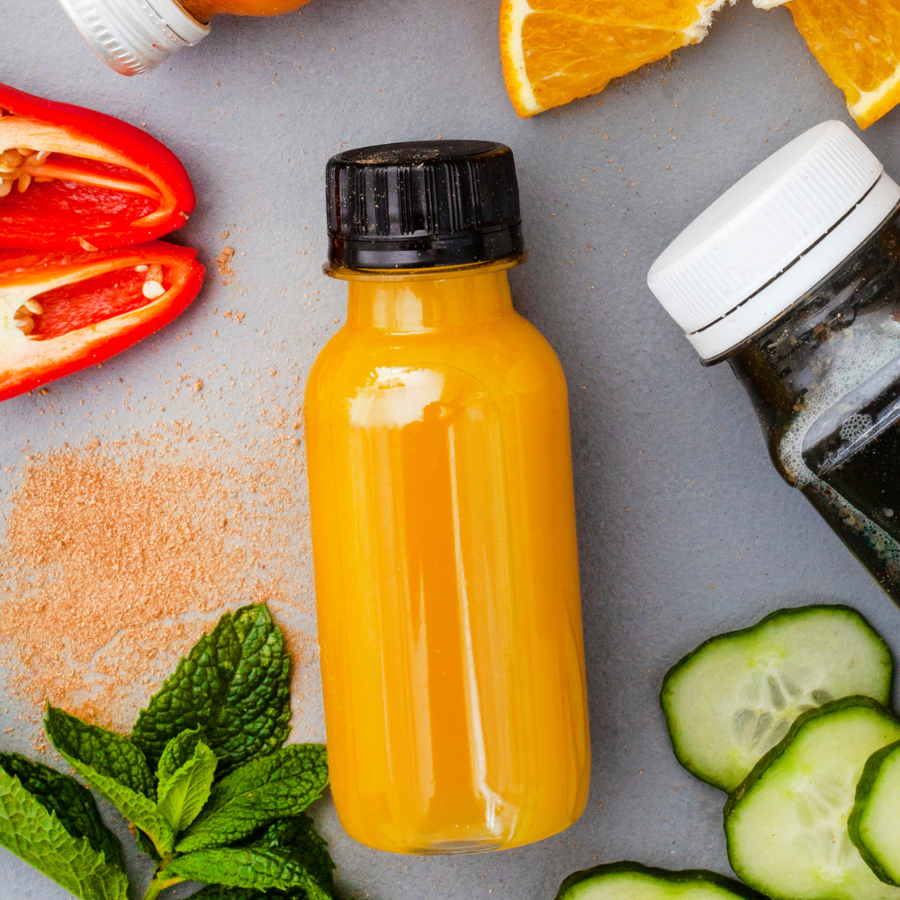 Homemade turmeric shots made with fresh turmeric, ginger, lemon, lime, and orange.