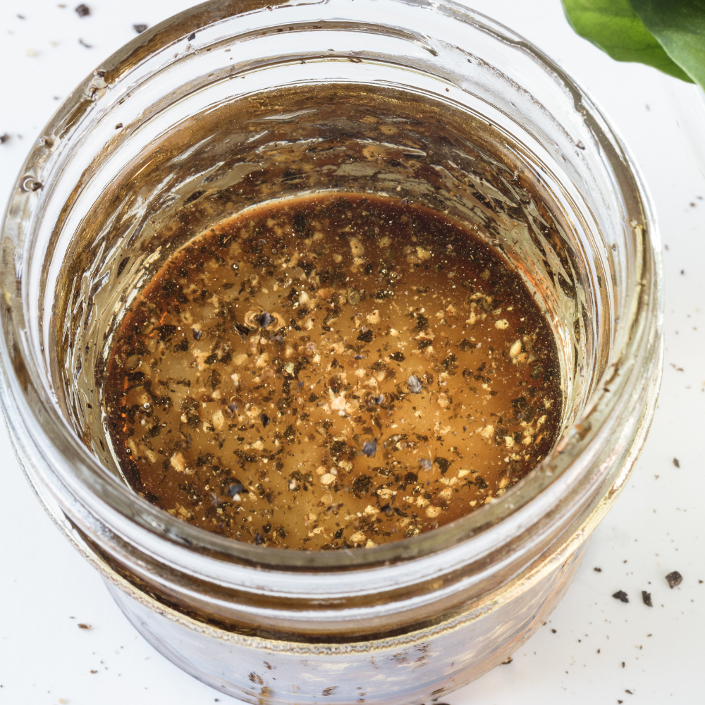 Anchovy vinaigrette with olive oil, lemon juice, garlic, parsley, and Dijon mustard for a flavorful salad dressing.