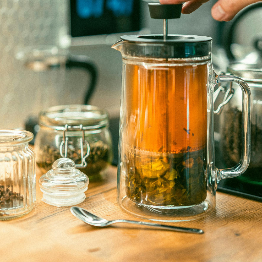 Brewing black tea in hot water for homemade sweet tea.
