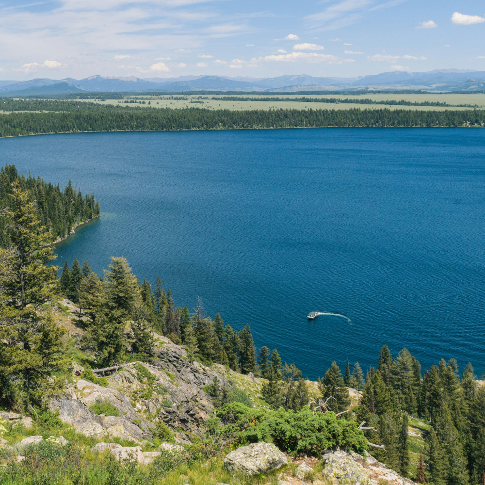 Rowboats on Jenny Lake in Grand Teton National Park with Cascade Canyon in the background.