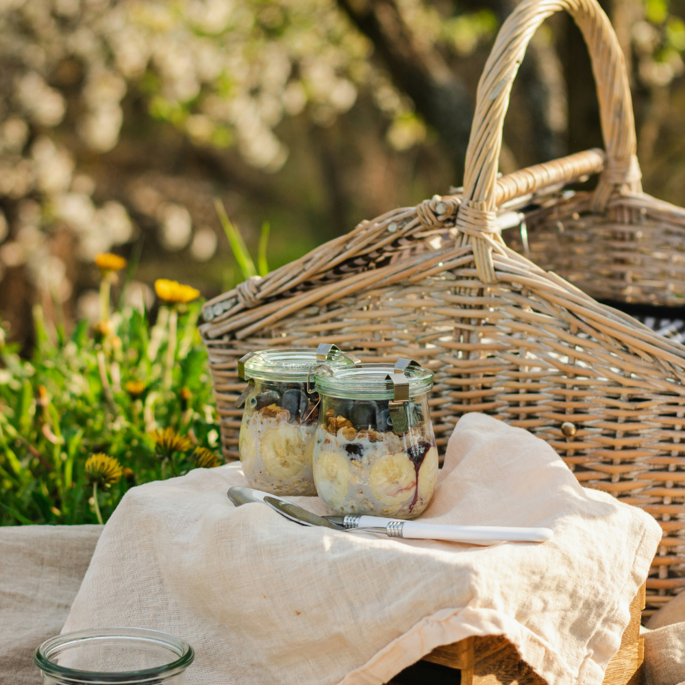 Breakfast picnic for couples or friends with fresh pastries, fruit, coffee, and a scenic outdoor view
