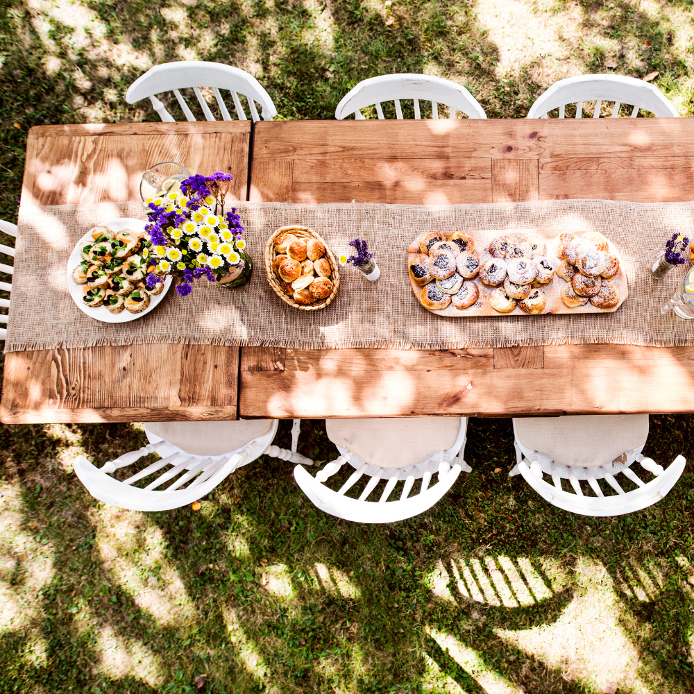 Farm to table garden party with fresh vegetables, bread, and rustic table decor