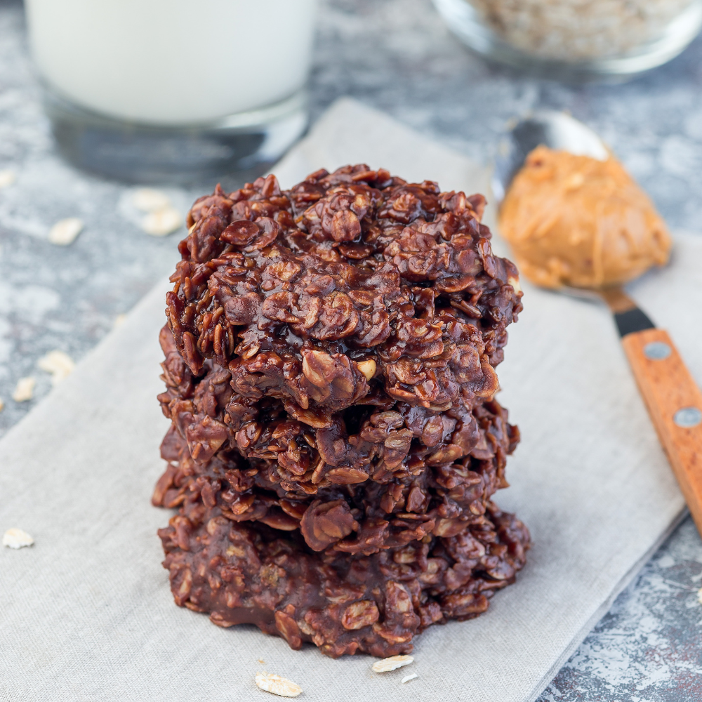 Chocolate peanut butter no-bake cookies made with peanut butter, cocoa powder, and coconut oil and oats.