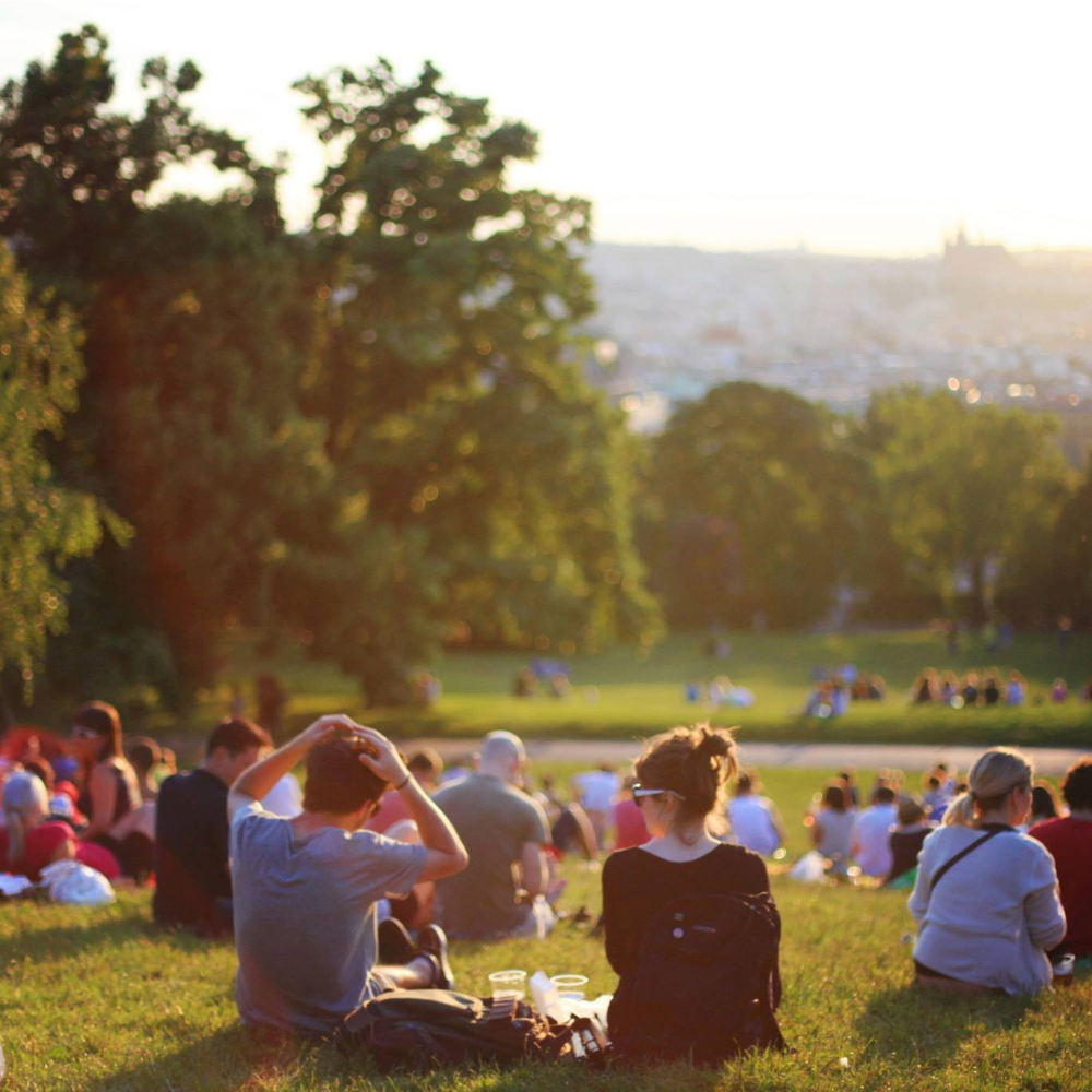 Outdoor summer concert in Crested Butte Town Park with people enjoying live music and mountain scenery