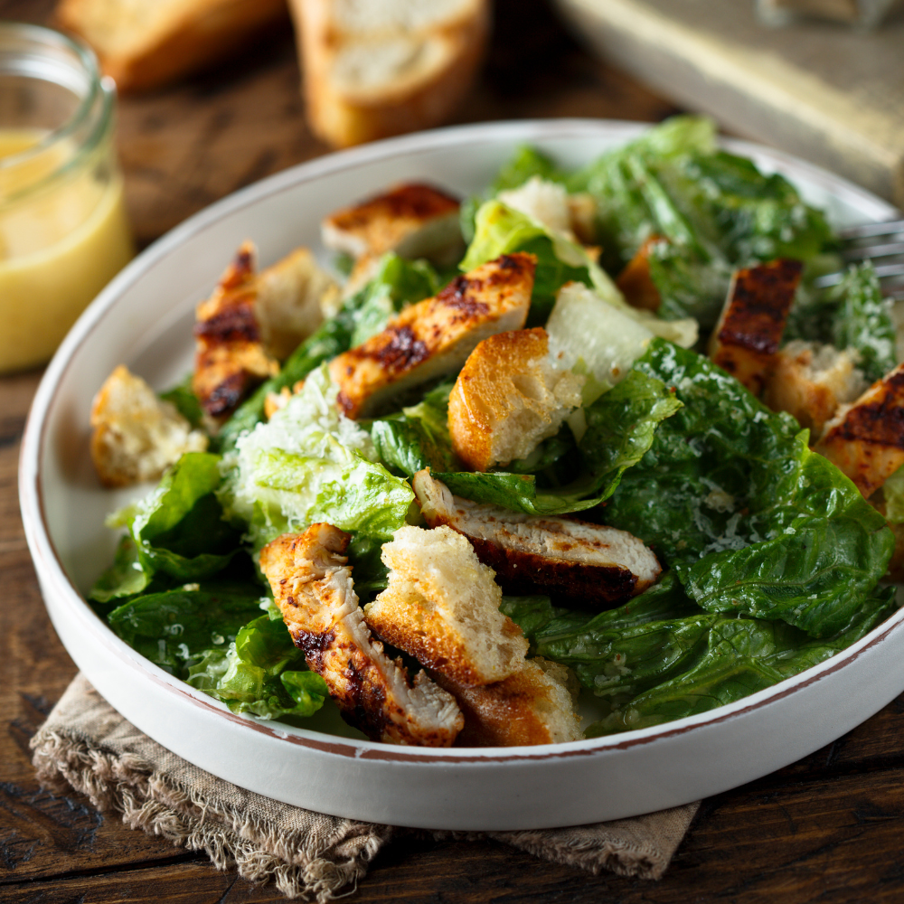 Close-up of the best homemade kale Caesar salad with crisp kale, romaine and Parmesan