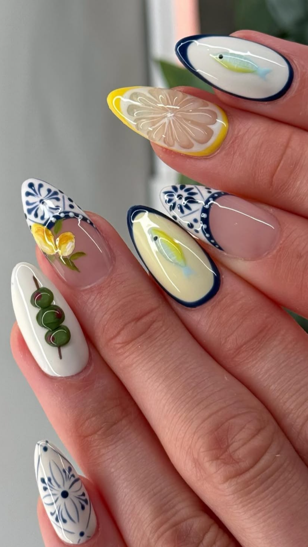 Spring nails with yellow, green and blue accents over a white and clear base