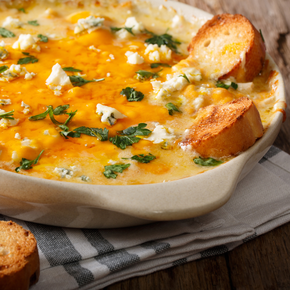 New Orleans style buffalo chicken dip with Cajun seasoning and melted cheese, perfect for party dips.