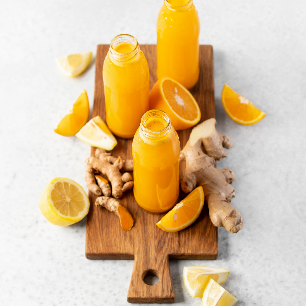 Fresh homemade turmeric shots stored in small glass bottles.