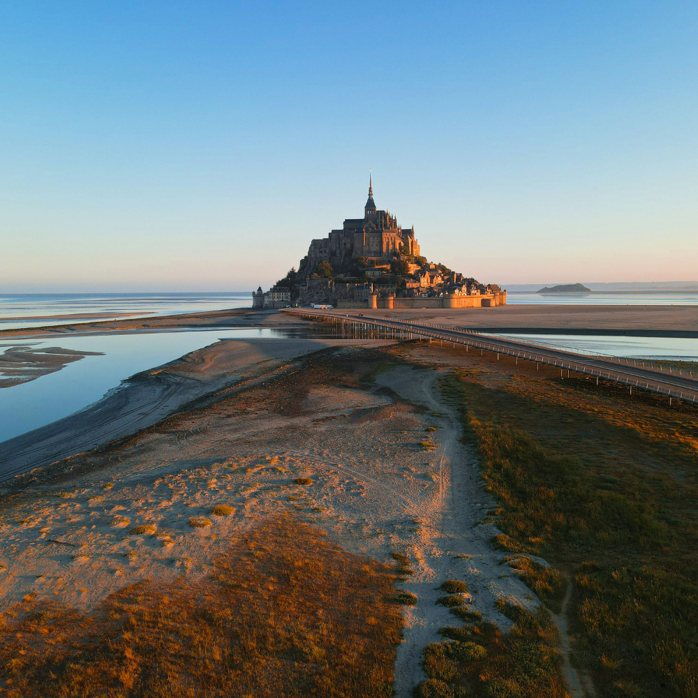Mont Saint Michel rising from the sea during a Normandy road trip.