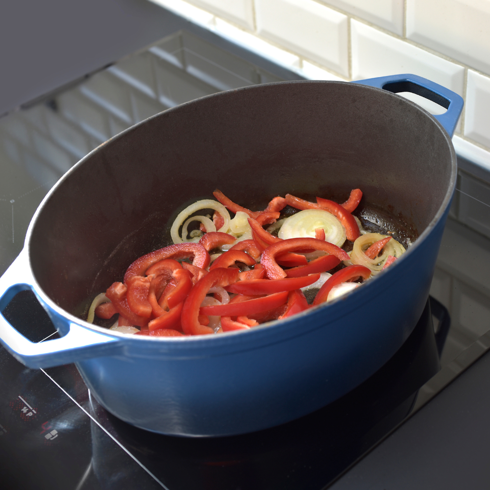 Sauteeing chopped onions and minced garlic in a pan for Spanish rice