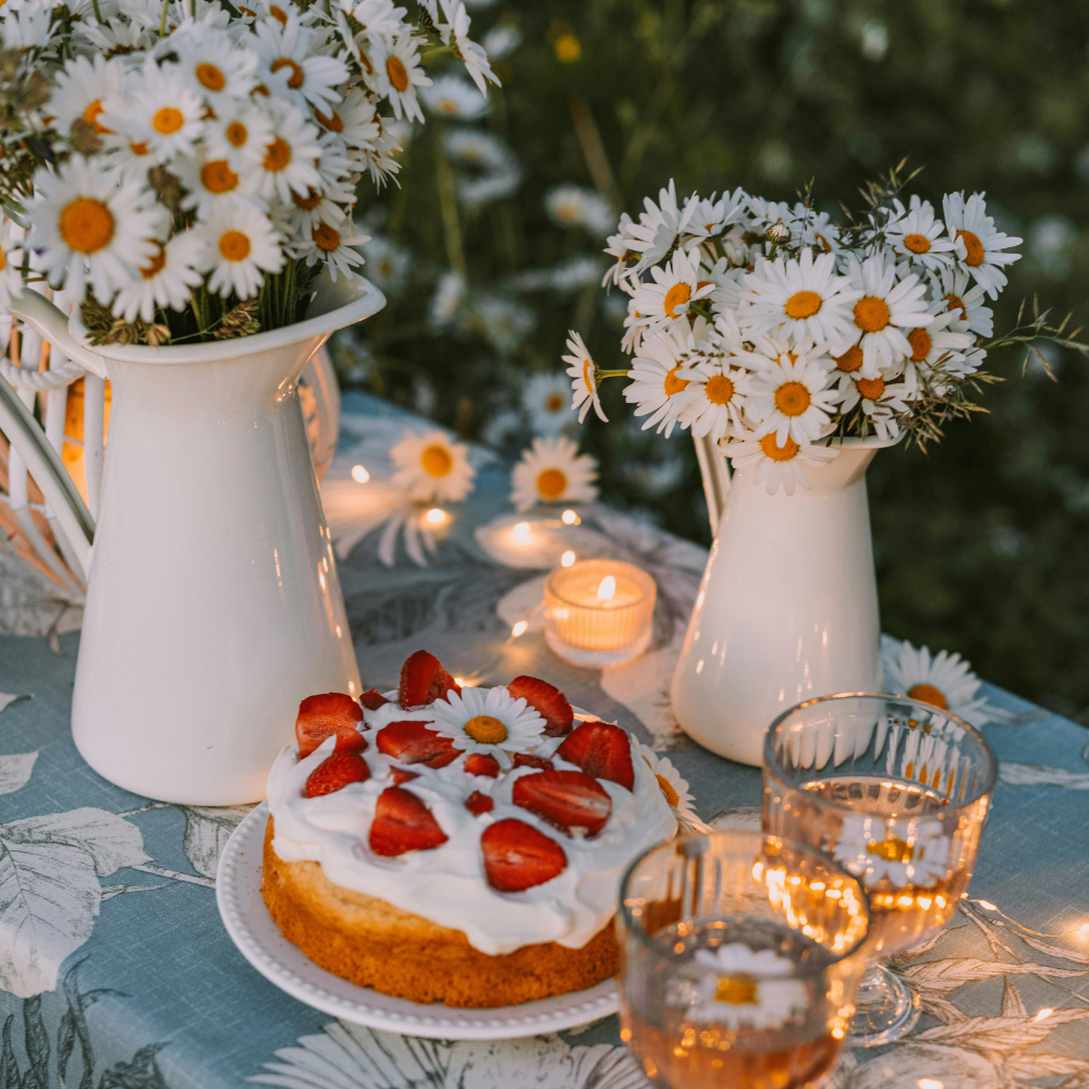 Mid-summer garden party with daisies, berries, and seasonal table decorations