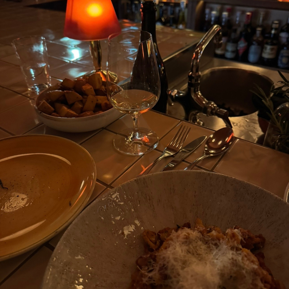 Dining at a local restaurant in Crested Butte featuring seasonal dishes and cozy mountain ambiance