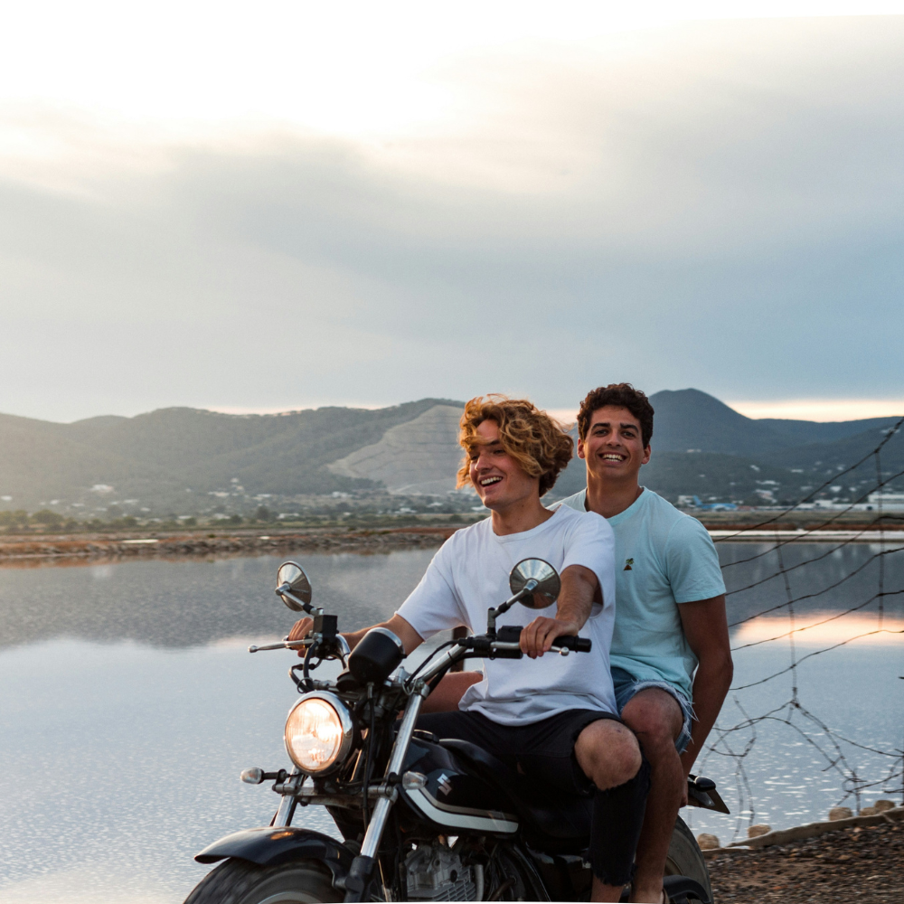 Friends traveling together on a motorcycle road trip during summer adventure.