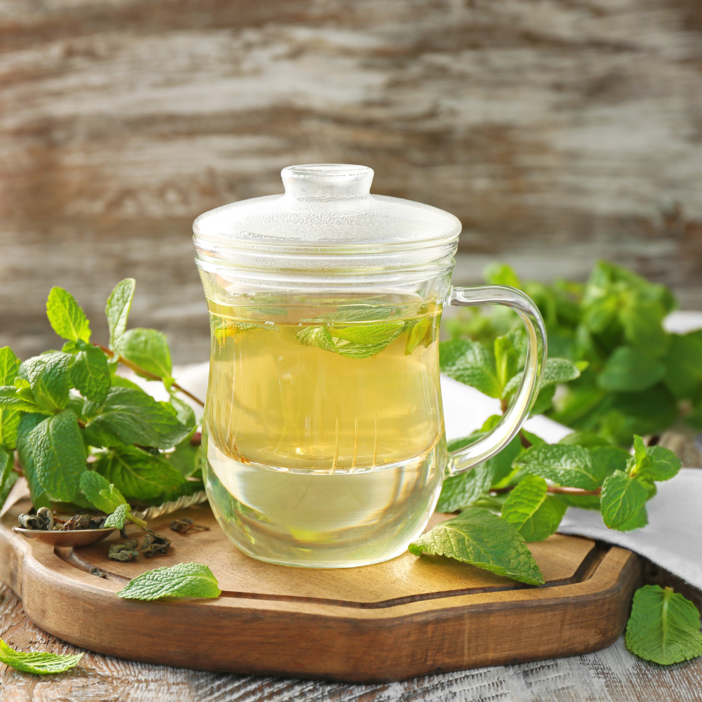 Fresh mint iced tea made with whole mint leaves and ice cubes.