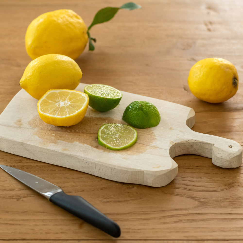 Cutting fresh lemons for a homemade cayenne pepper lemon shot
