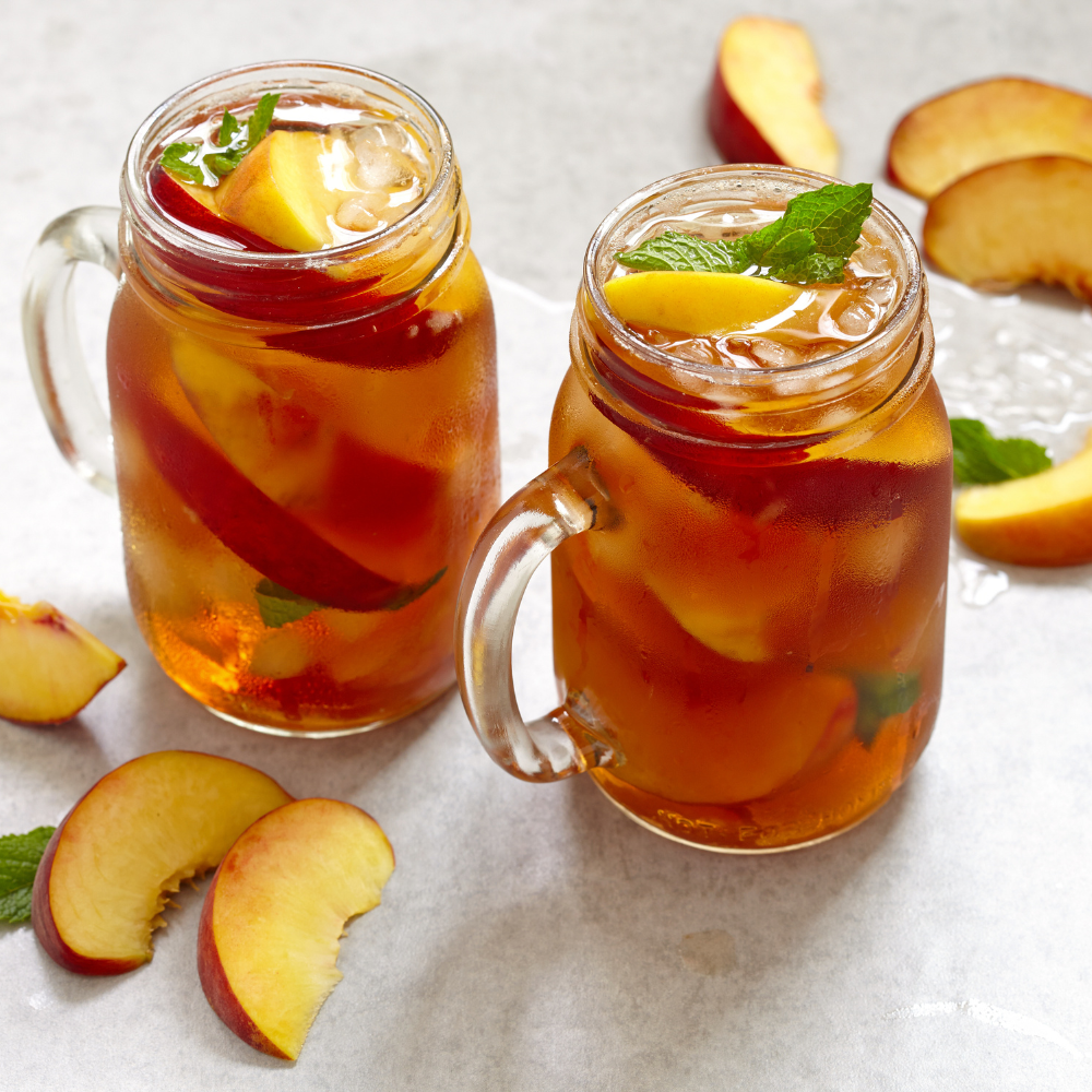 Sparkling peach black tea, alcohol free with fresh peaches, black tea, and ice