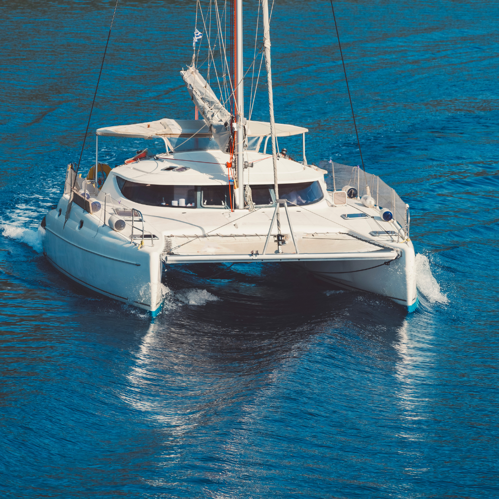 Catamaran sunset cruise in Aruba with Caribbean coastline views