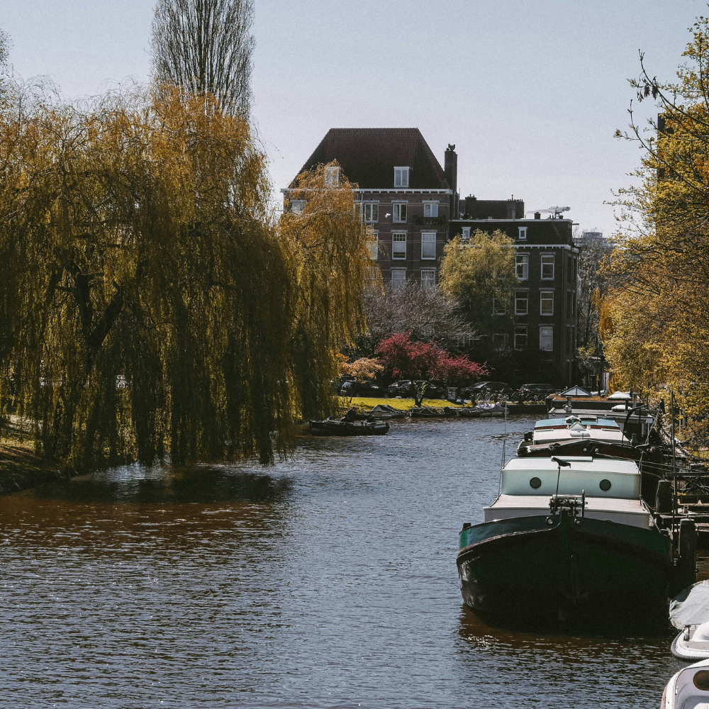 Amsterdam canals at sunset during a Europe road trip.