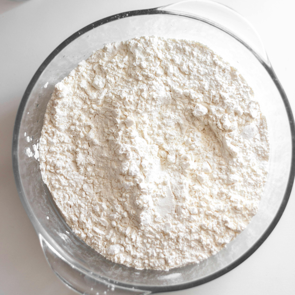 Measured dry ingredients including flour, baking powder, and salt for strawberry shortcake.