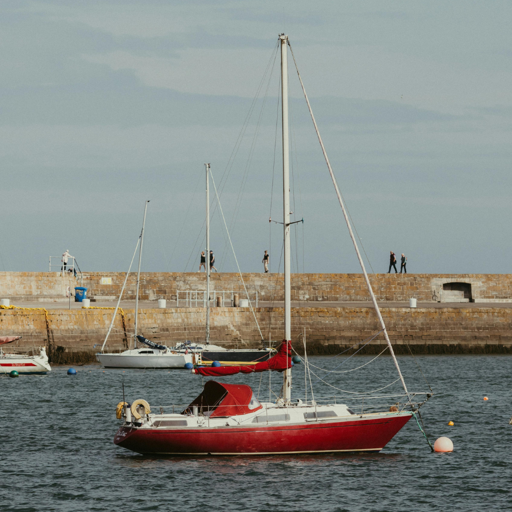 Fishing boats docked at Howth Harbor in a traditional Irish fishing village