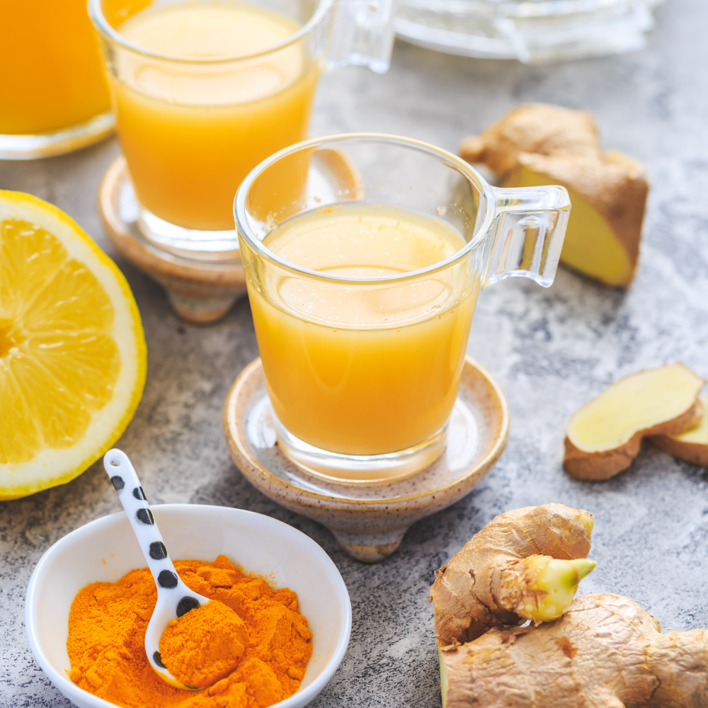 Homemade ginger shots made with fresh ginger, lemon, turmeric, and cayenne for immune support