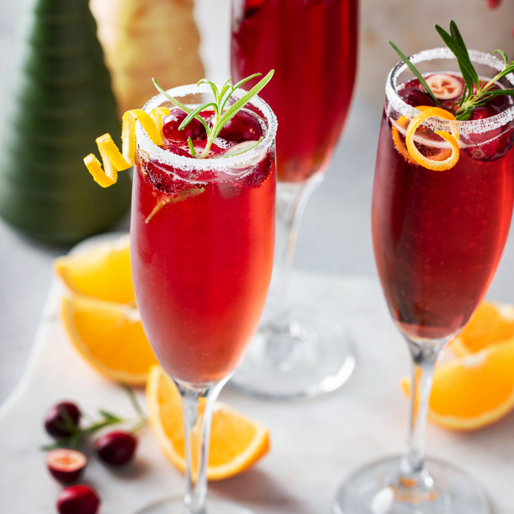 Close-up of Christmas punch with frozen cranberries and citrus slices