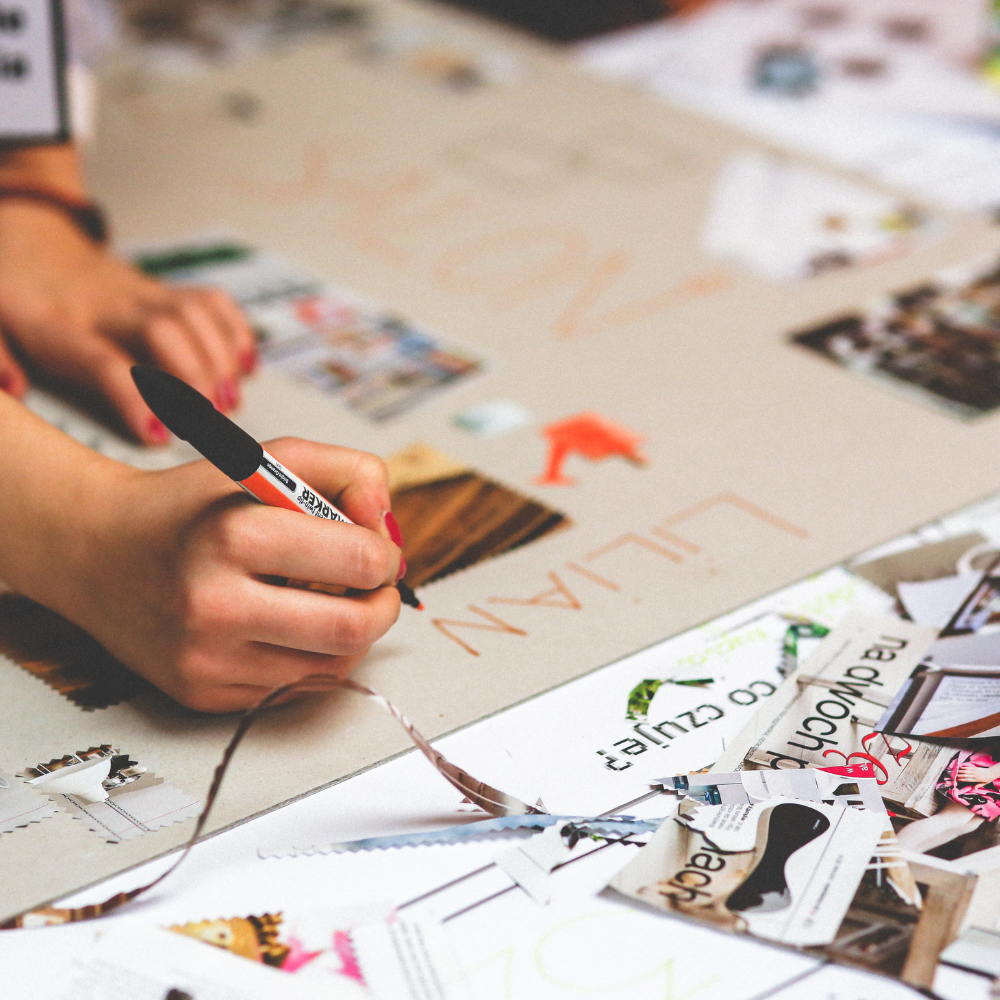 DIY family calendar with photos, marked dates, and handwritten notes as a personalized Mother’s Day gift