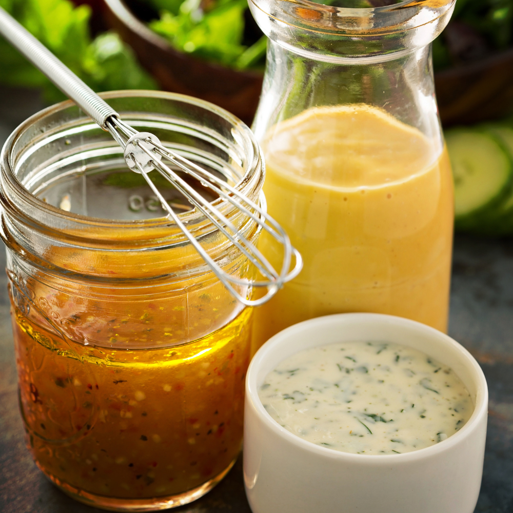 Preparing homemade dressing for cucumber tomato salad using olive oil and vinegar.