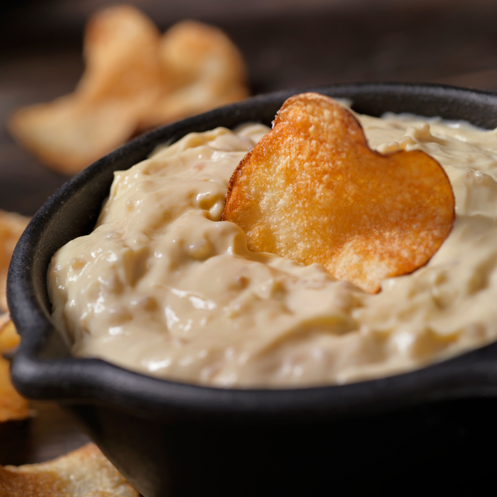 Warm French onion dip with caramelized onions and Gruyère cheese, perfect for party dips.
