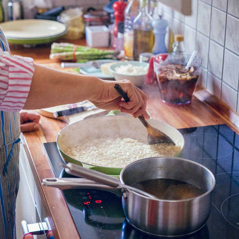 Arborio rice being toasted in olive oil with shallots and garlic for risotto