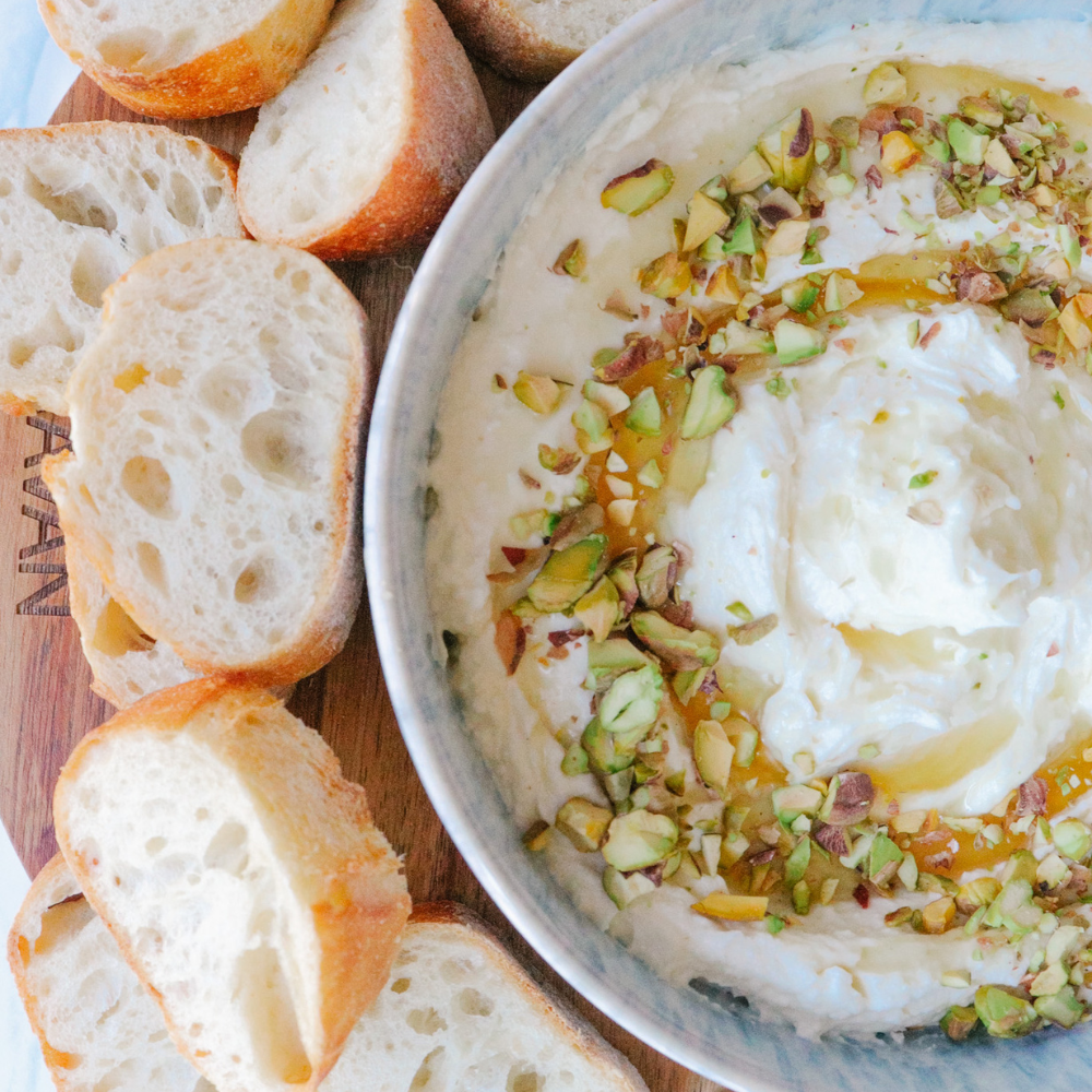 Whipped feta dip topped with caramelized pears and pecans, a unique dip for parties and holiday gatherings.