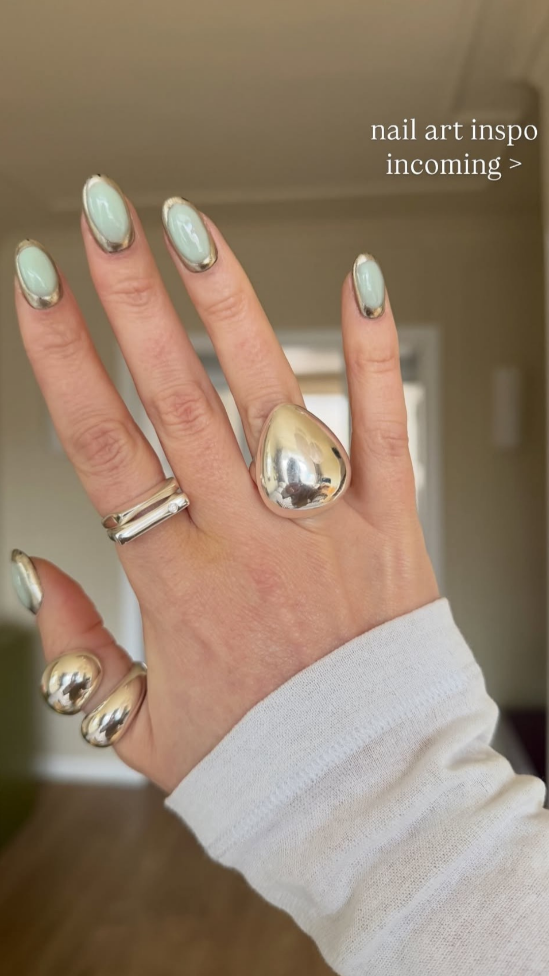 Pastel spring nails with glazed chrome on the side.