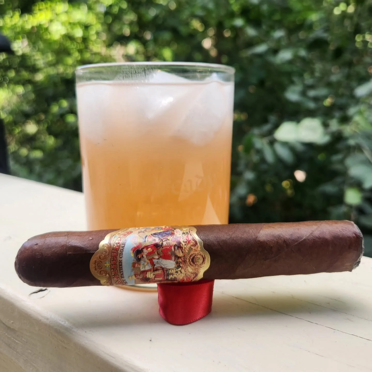 Does the flavor profile of your cigar influence what you choose to drink with it? Do you have a go-to beverage for smoking? Are there certain cigars you will never smoke with a particular drink? 
There's no wrong answers here. It's your cigar, your e