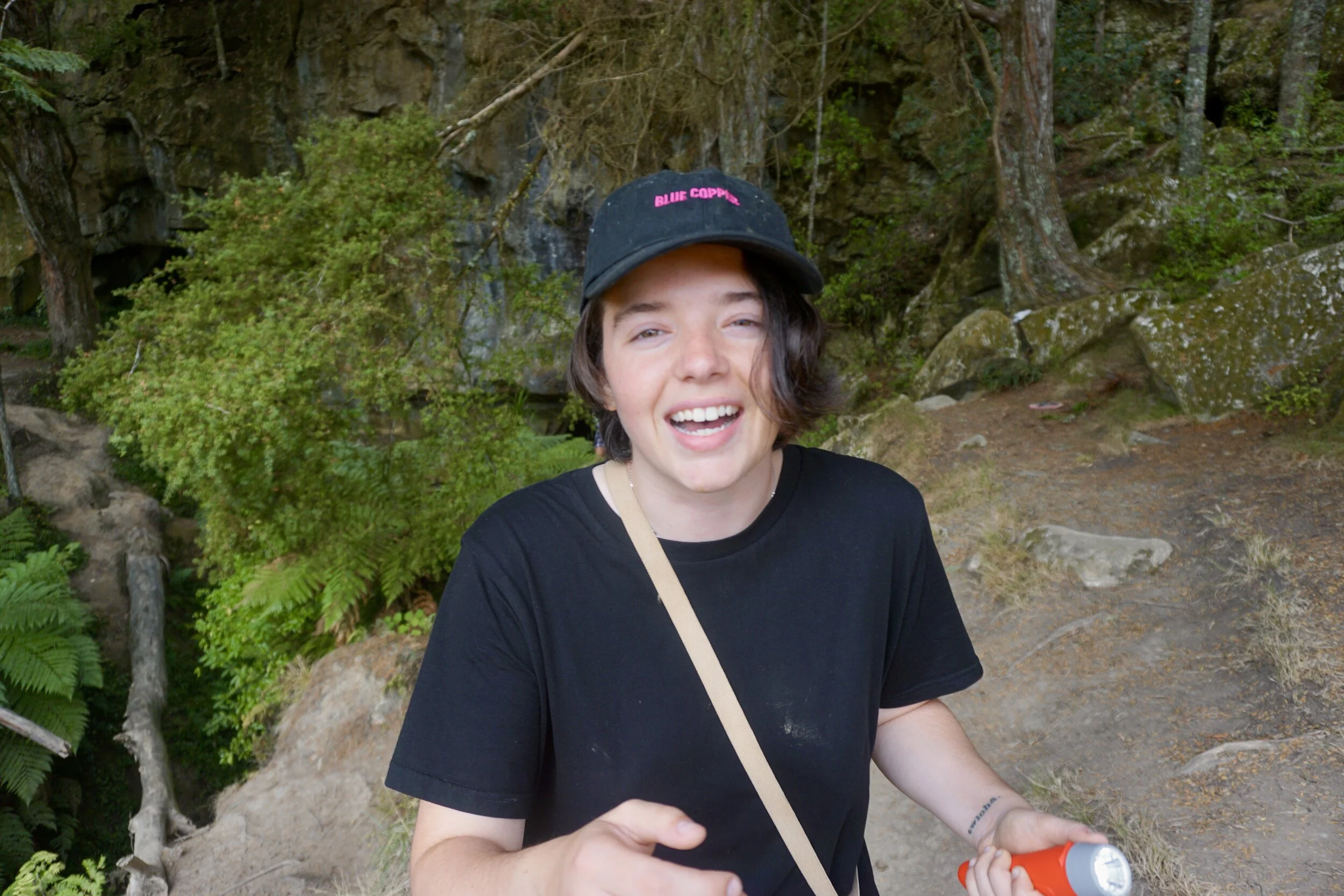 Me outside the caves crying because I love the worms so much.