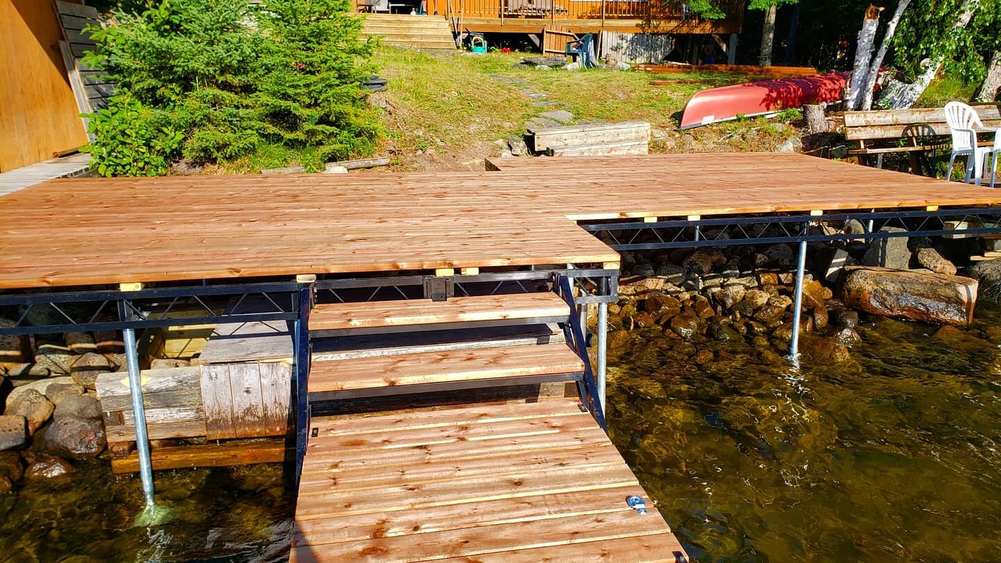 With a little bit of planning and muscle we removed the old decks, docks, and boat lift and replaced them with shiny new ones.

It was a tight squeeze to fit the boat inside the existing boat house/shelter. Some of the concrete footing and boulders h