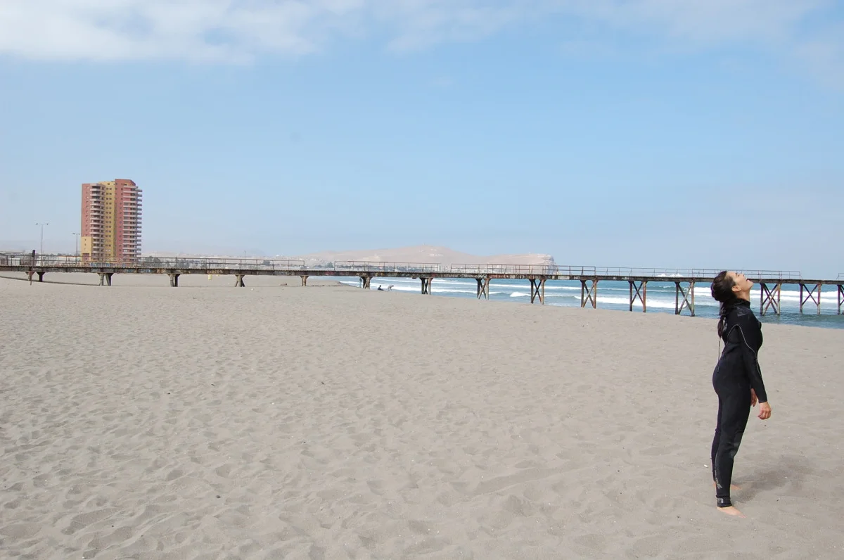 preparing for frigid surf in Iquique
