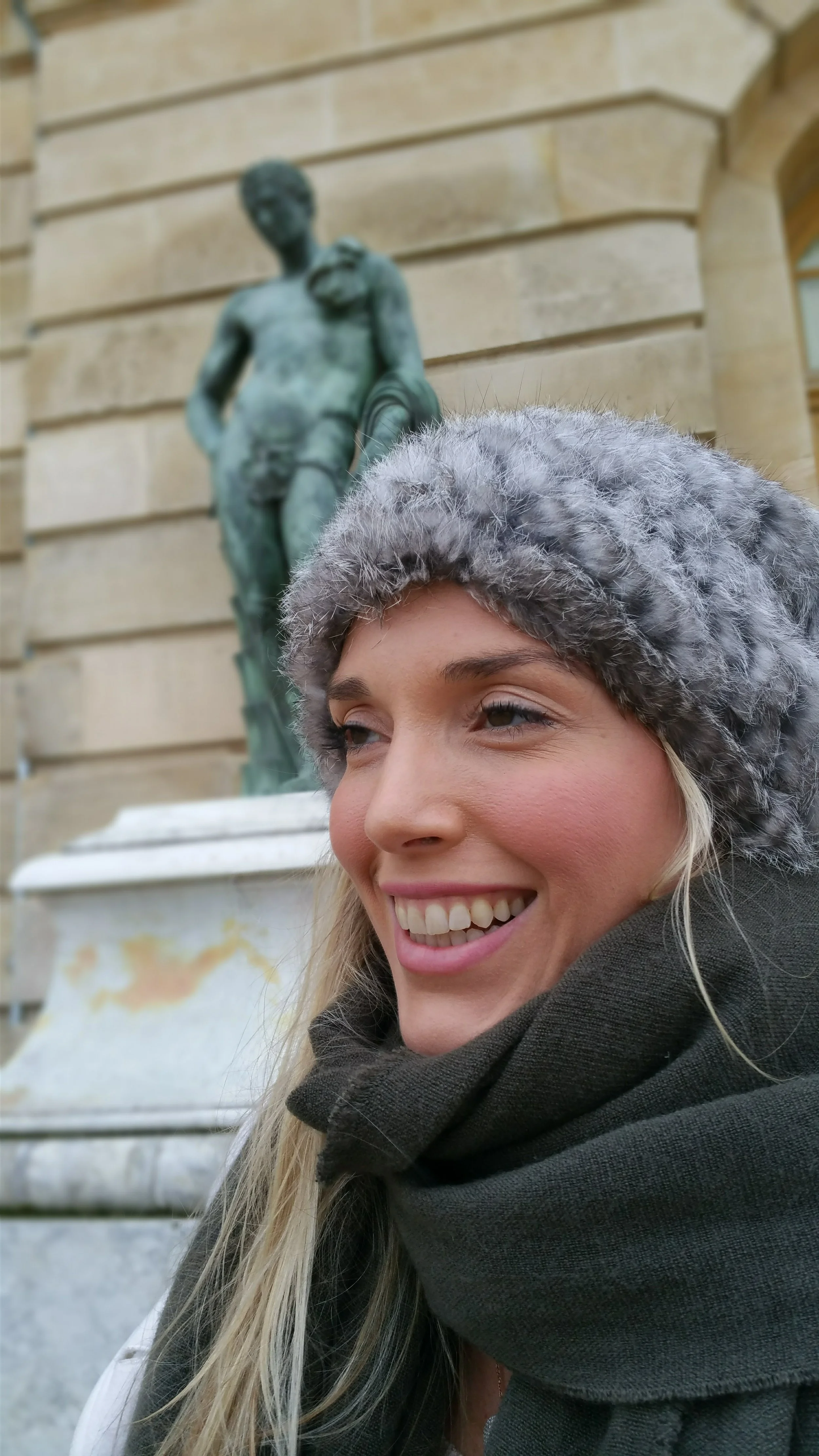 Elizabeth in front of a statue in France