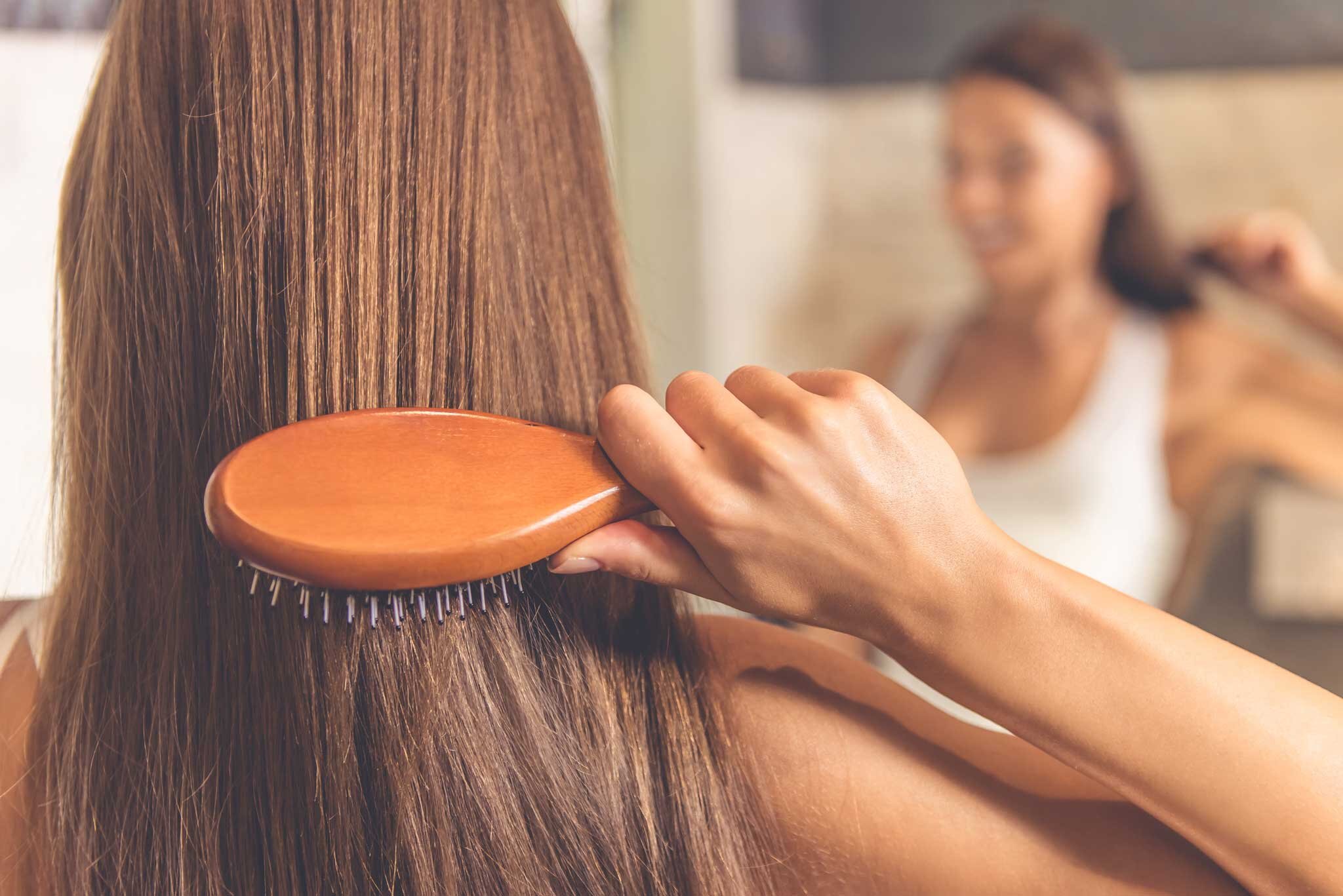 woman-brushing-hair-GettyImages-612734662.jpg