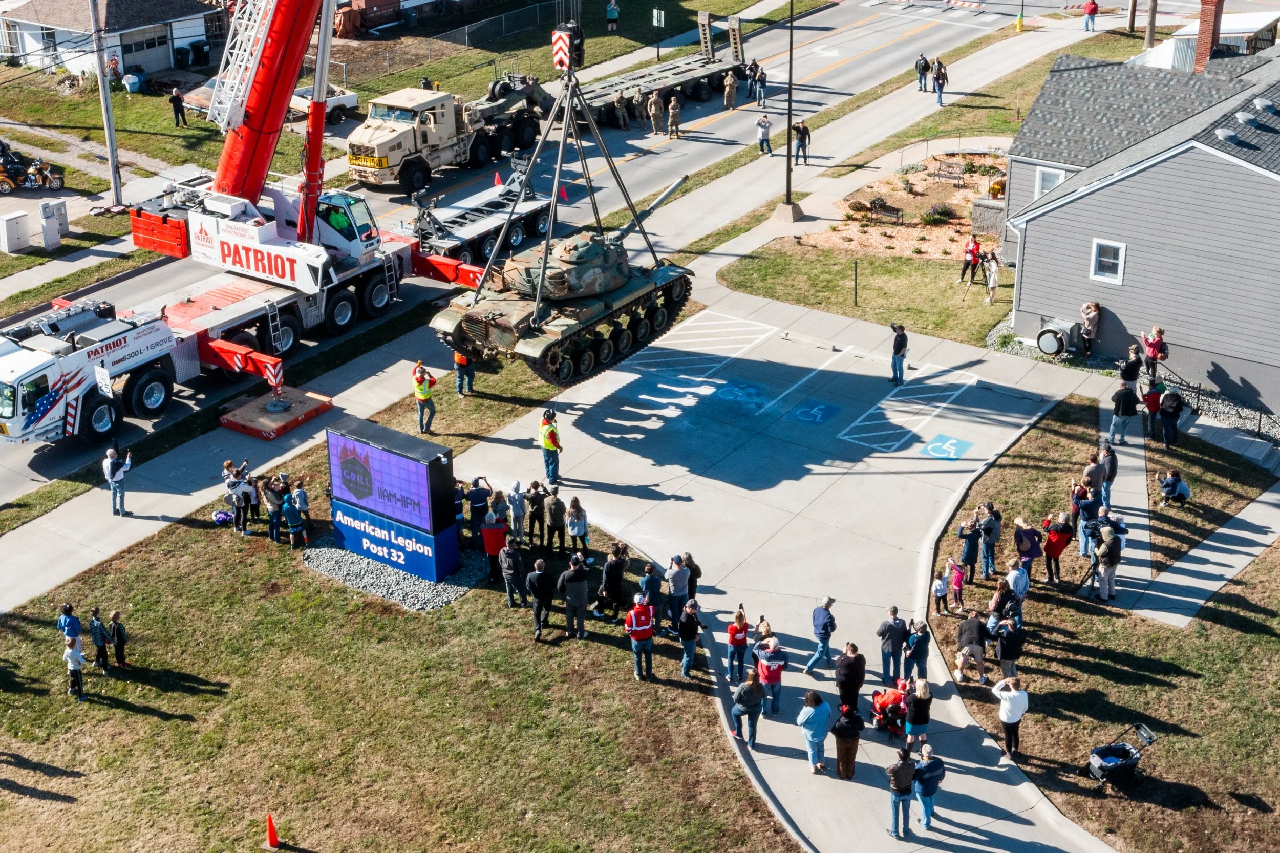 Patriot Crane setting an M60 Tank on American Legion Post 32 property for permanent display.