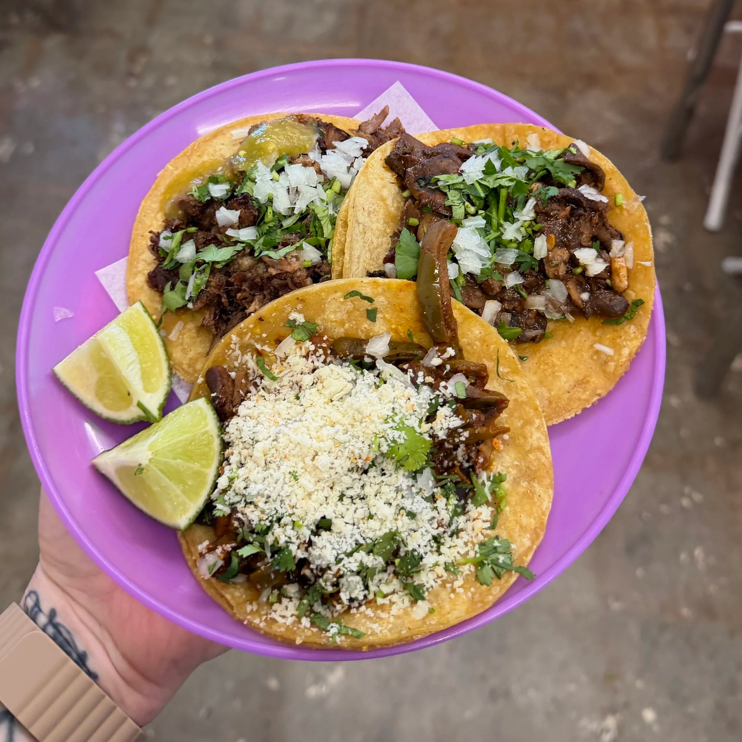 a plate with three tacos