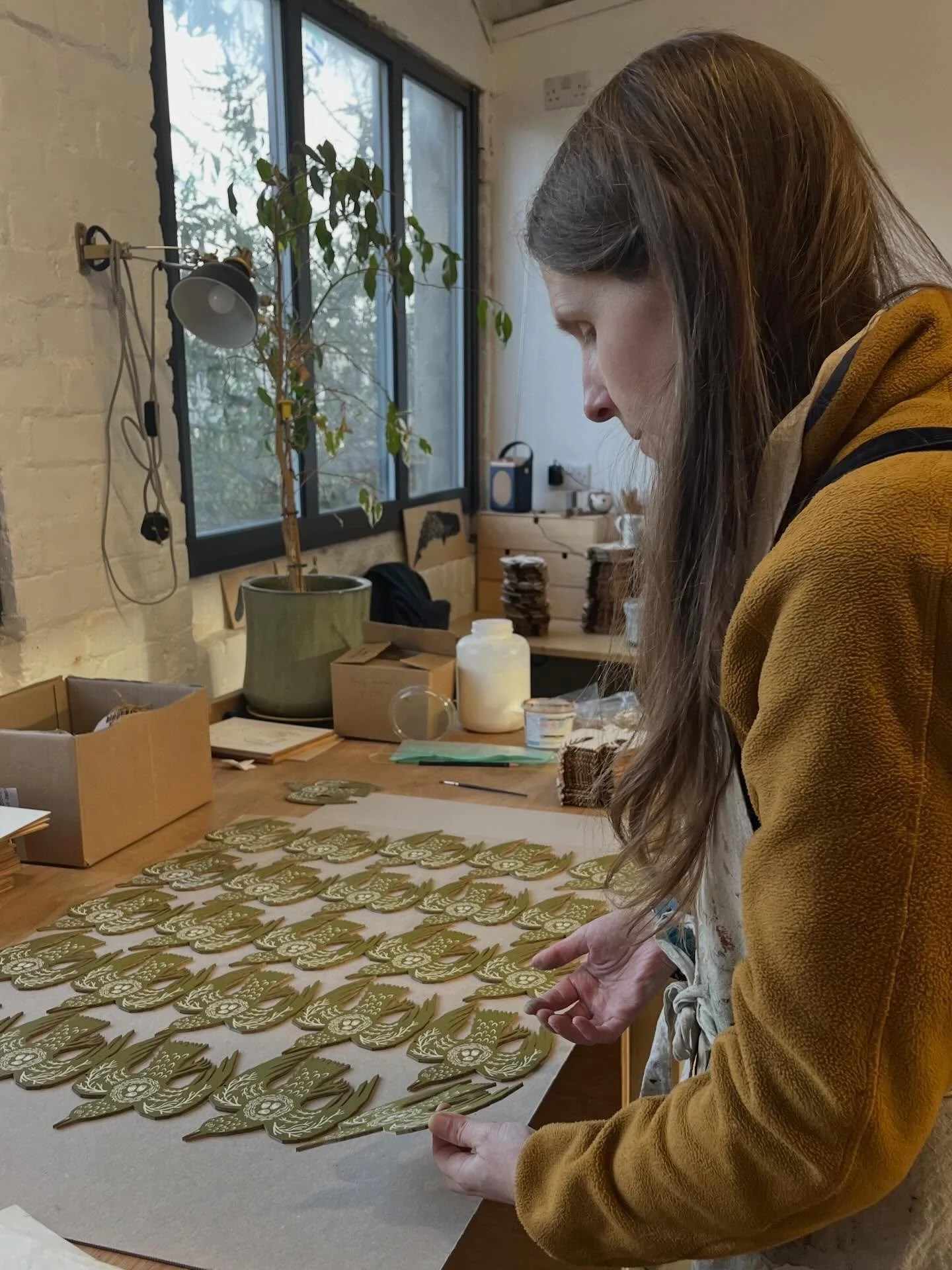 Some scenes from the studio today 🌞 Ruth &amp; Tony have been printing a fresh batch of woodland bird decorations in the winter sunshine. 

We love mixing up the ink for this particular decoration. It&rsquo;s a combo of quite a few different very br