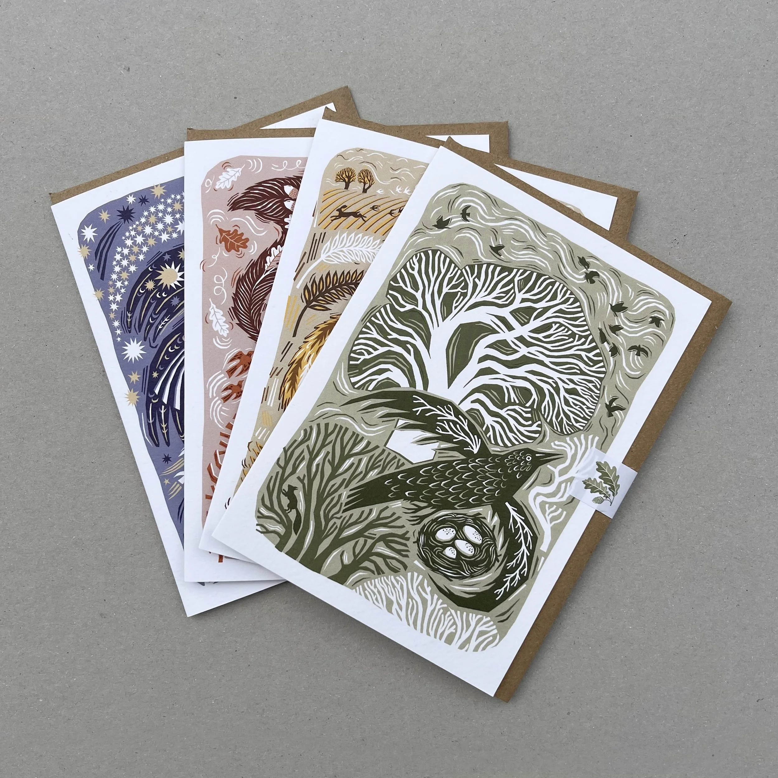 A greetings card featuring a bird flying though the winter woods ...
