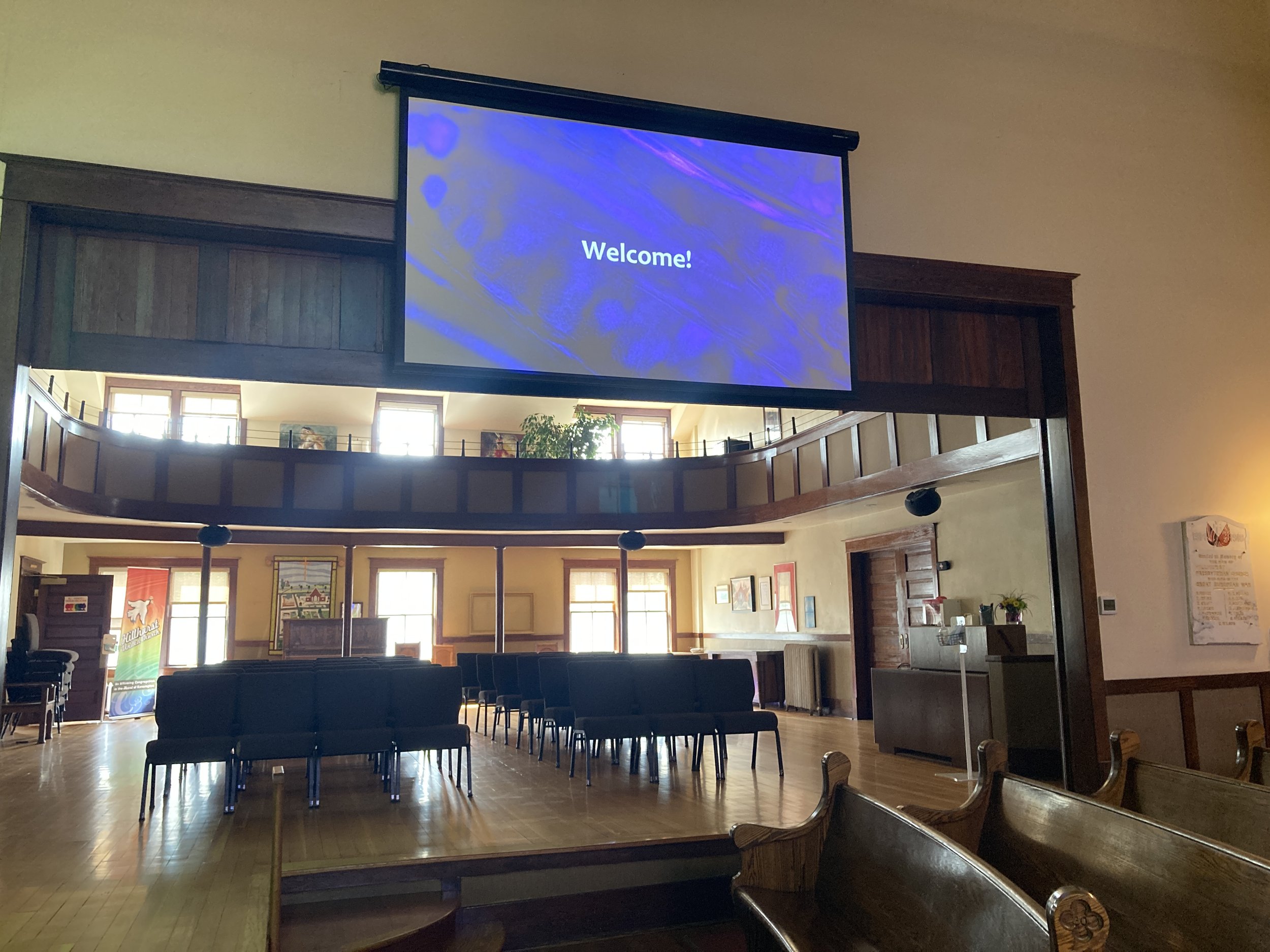  Projector screen in the sanctuary and a view of the Heritage Room. 