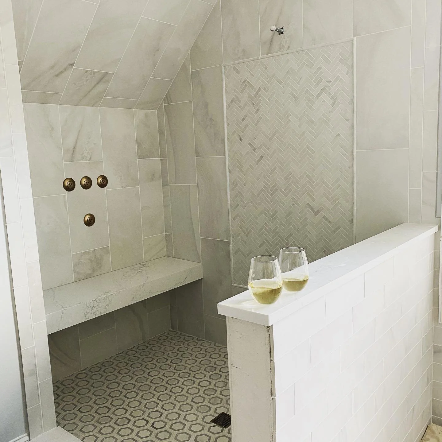Site check for a bathroom renovation! Thank you @triangletileandstoneofnc for the gorgeous tile detail! Added bonus when my client greets me with a cold white wine on a hot summer day! ☀️