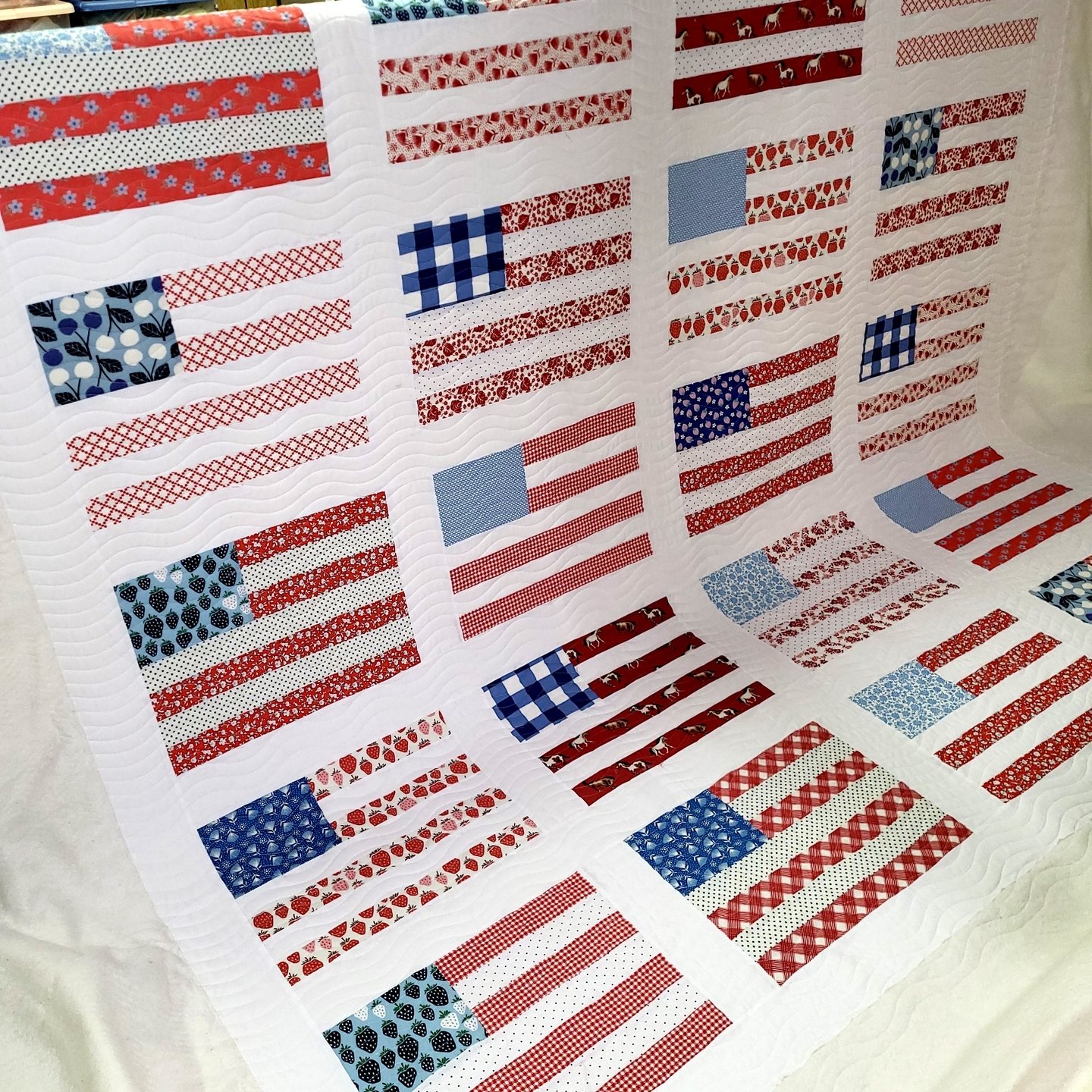 Bethany sent this Stars &amp; Stripes quilt to me recently and I LOVE all of the different fabrics that make up the flags!'

It's fantastic!

Bethany was also a first-time client, so she got a 20% discount on quilting services! All first-time clients