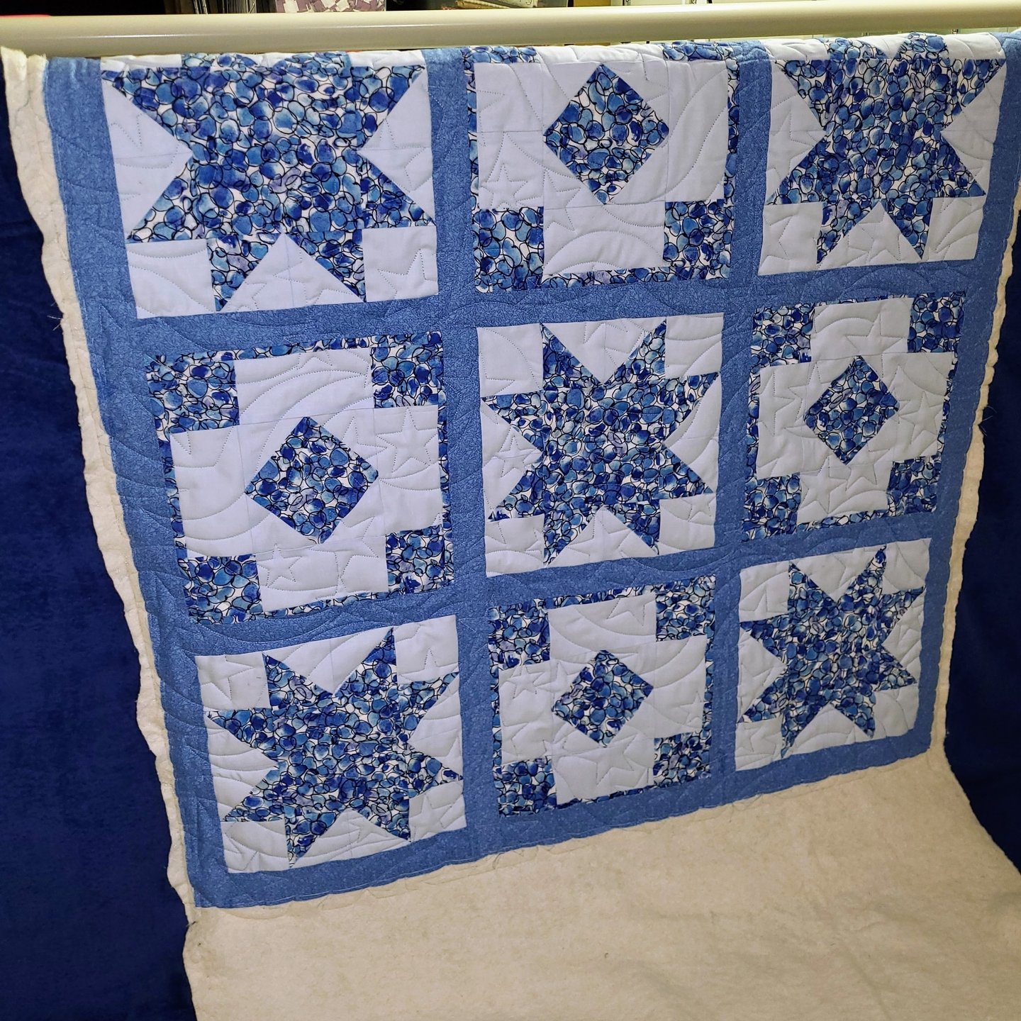 I am thrilled to play a small role in creating such heartfelt gifts, and this one is absolutely no exception!

Christine crafted this charming baby quilt, and I love it!

The way she balanced the three fabrics creates a palette that's both simple and