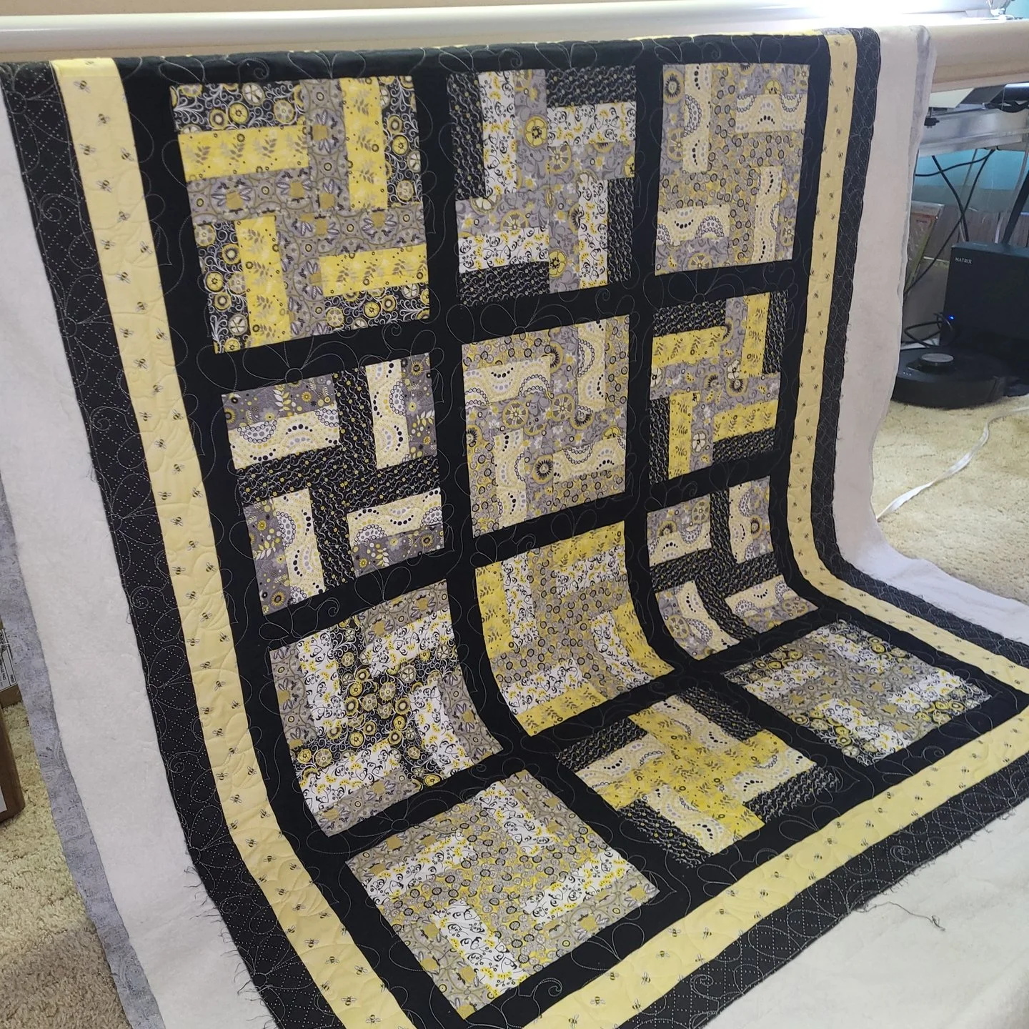 This quilt was part of a rescue mission!

Christine said she rescued these blocks from a thrift store, and I'm so glad she did! She was able to piece together one amazing quilt!!

I added some sweet little bees to it with the quilting. 🐝

Thank you 